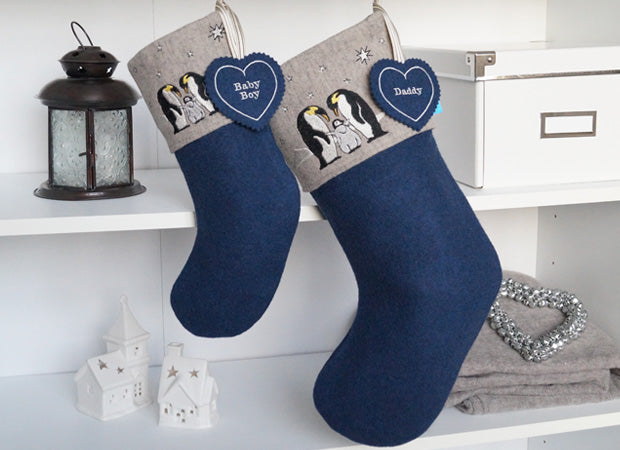 Penguin Christmas Stockings lifestyle shot with personalised name tag by Kate Sproston Design