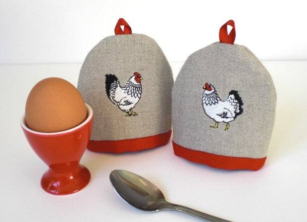 Mr &amp; Mrs Egg Cosies with an egg cup by Kate Sproston Design