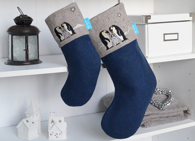 Penguin Christmas Stockings lifestyle shot without personalised name tag by Kate Sproston Design