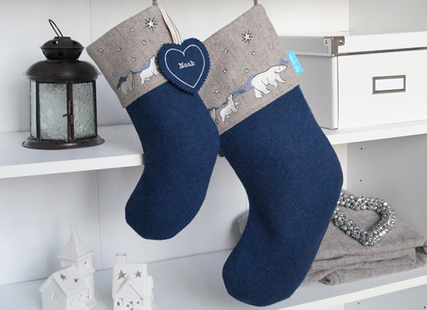 Polar Bear Christmas Stocking lifestyle shot with personalised name tag by Kate Sproston Design