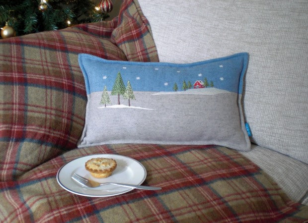 Winter Lodge Christmas Cushion lifestyle shot by Kate Sproston Design